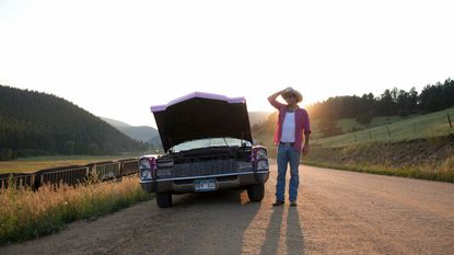 Man and car with hood up