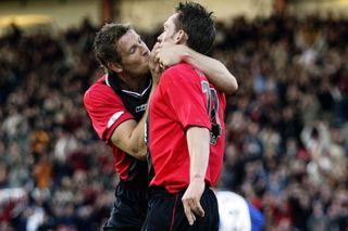 James Hayter is congratulated by team-mates Steve Fletcher after scoring for Bournemouth against Bury in May 2003.