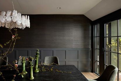 a dining room with grasscloth