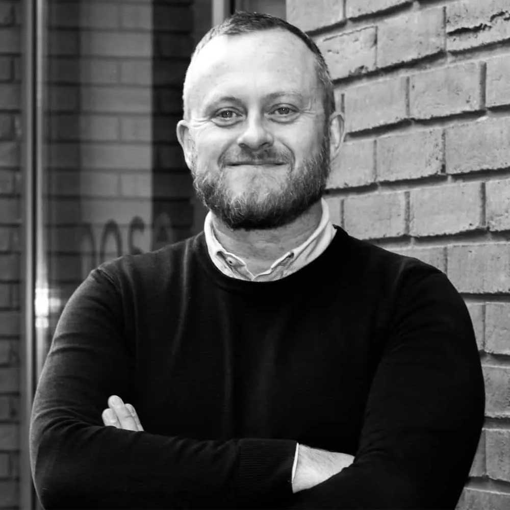 black and white headshot of architect Bryn Jones