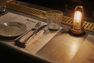Place setting at a bar seat of The Palomar London restaurant