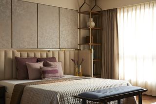 A bedroom with panels all wallpapered