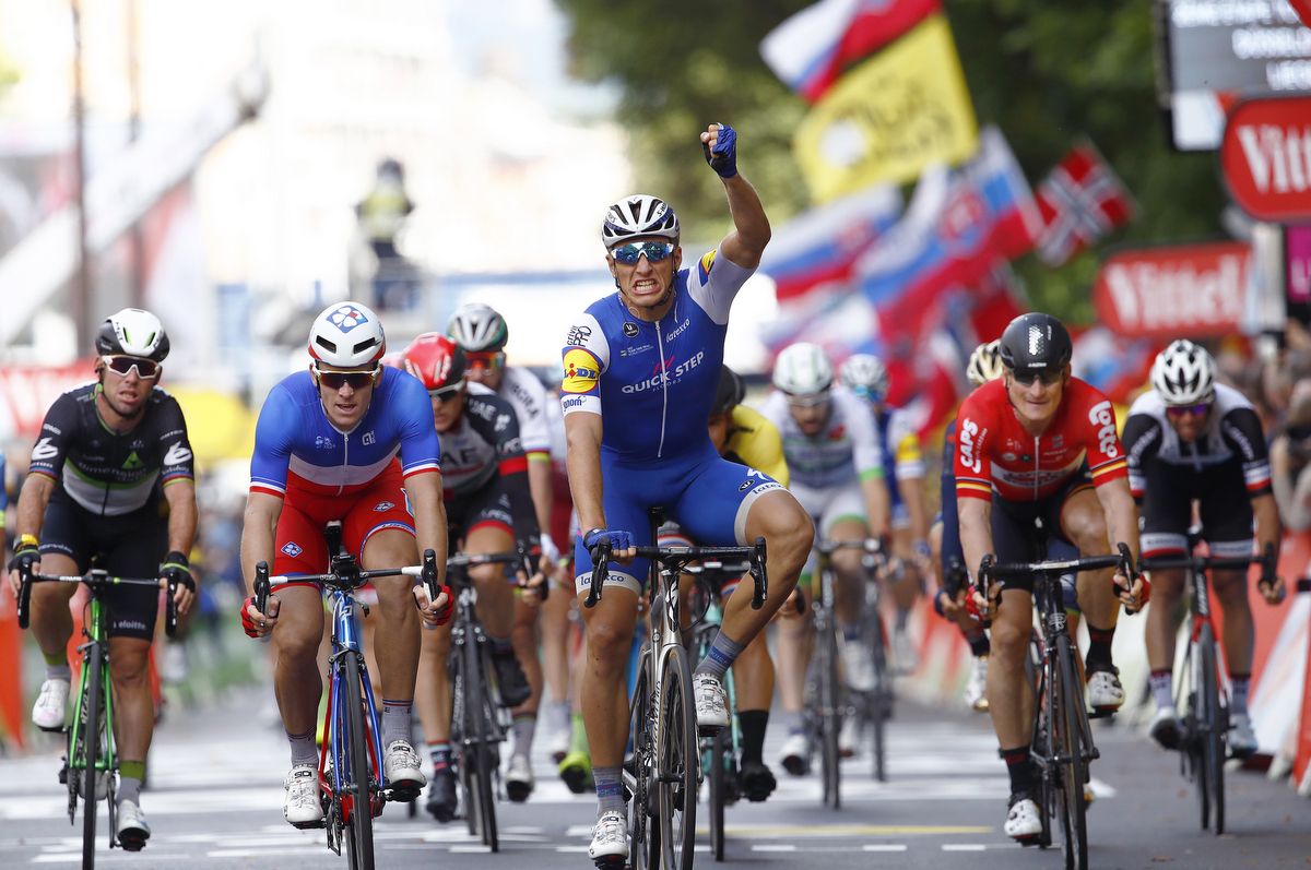 Mark Cavendish (Dimension Data), left, finishes fourth in the stage 1 sprint