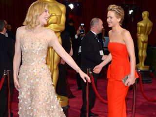 Jennifer Lawrence in a red Dior dress at The Oscars 2014Jennifer Lawrence and Cate Blanchett at The Oscars 2014