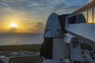 The sun rises behind SpaceX’s Crew Dragon spacecraft and Falcon 9 rocket, which stands ready for launch at Launch Complex 39A at NASA's Kennedy Space Center in Florida, on May 24, 2020.