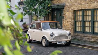 Mini eMastered by David Brown Automotive parked outside house