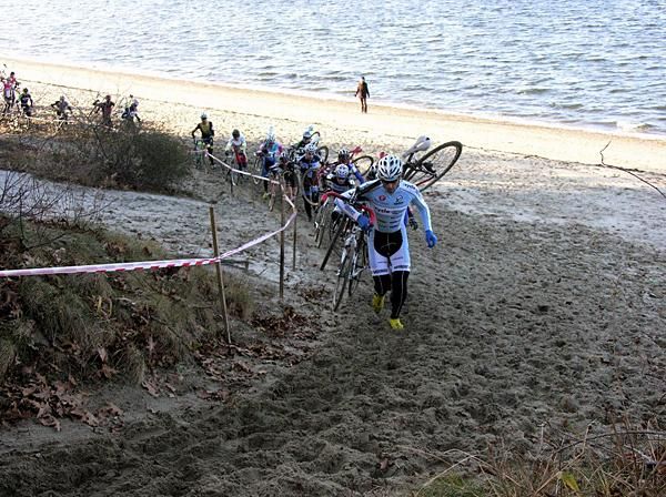 Adam Myerson leads the elite men on the beach during the first lap after taking the hole shot.