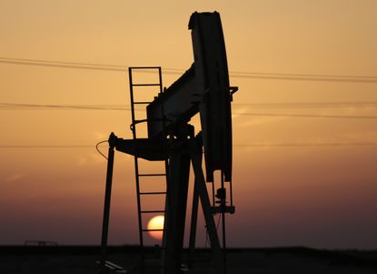 An oil pump works as the sun sets