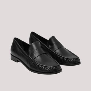 Flat lay image of black loafers