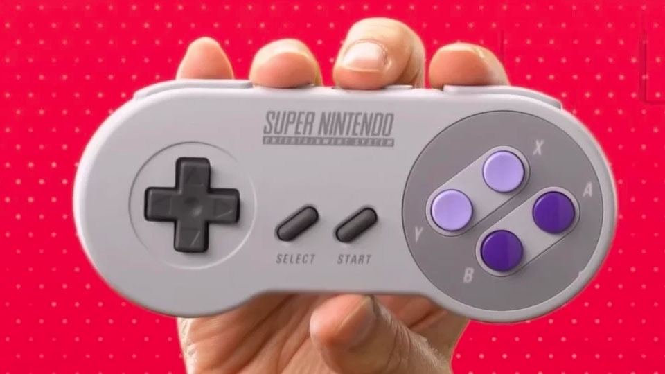 SNES controller being held by a gamer