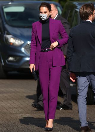 Kate Middleton wearing a purple suit.