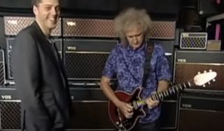 Brian May (right) plays the Bohemian Rhapsody solo for Iain Lee (left)
