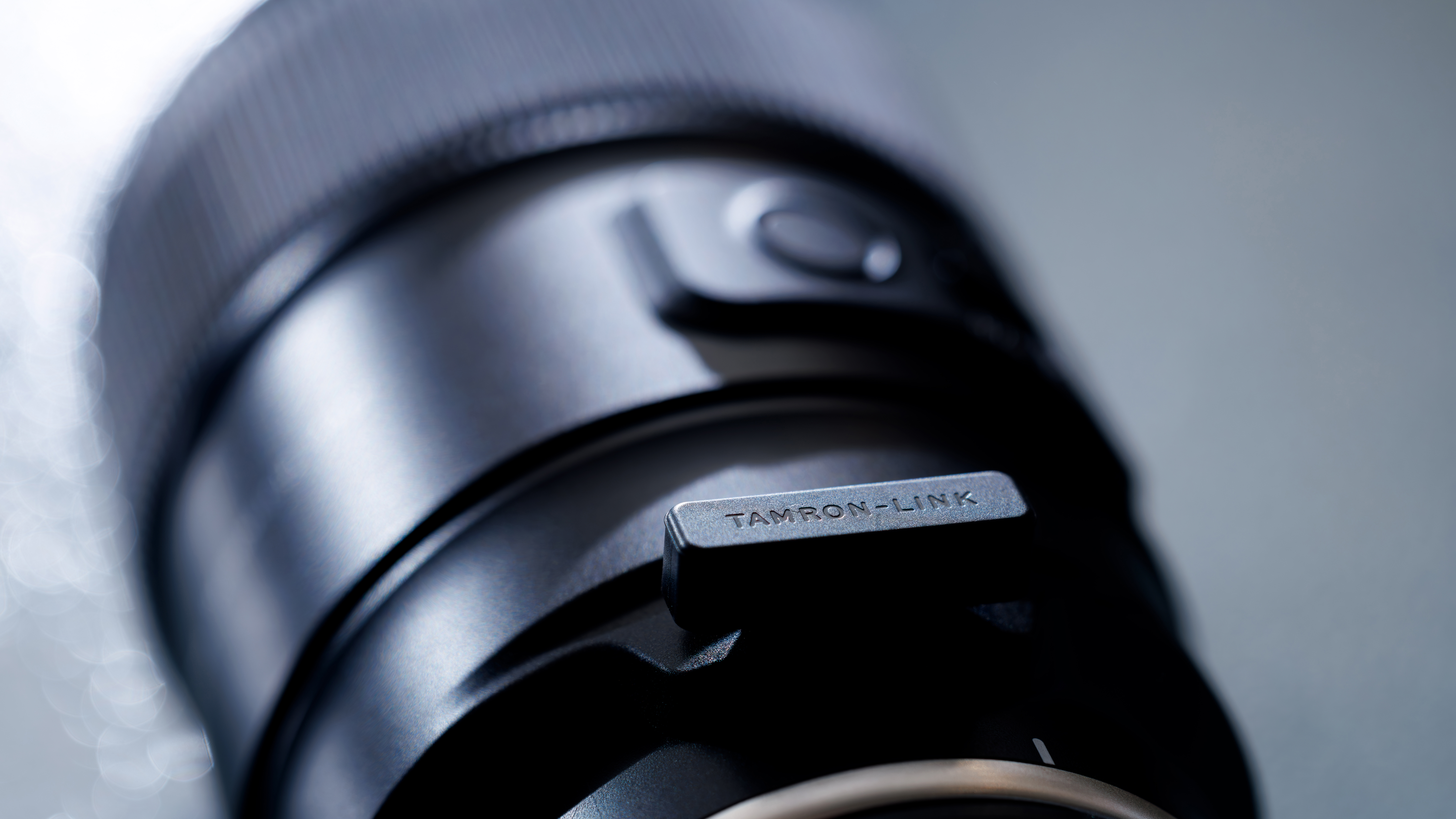 A close-up of the Tamron-Link on a lens