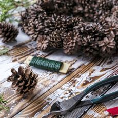 Making a pinecone Christmas wreath