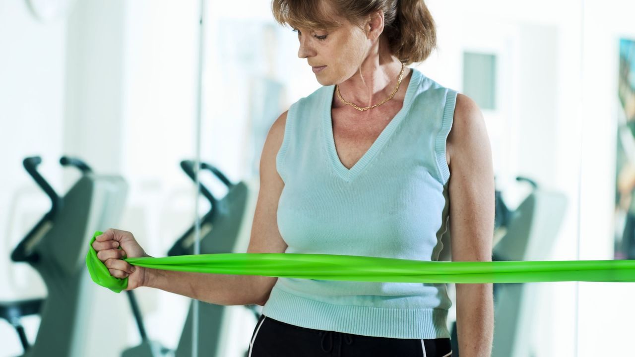 Woman performs a rotator cuff drill