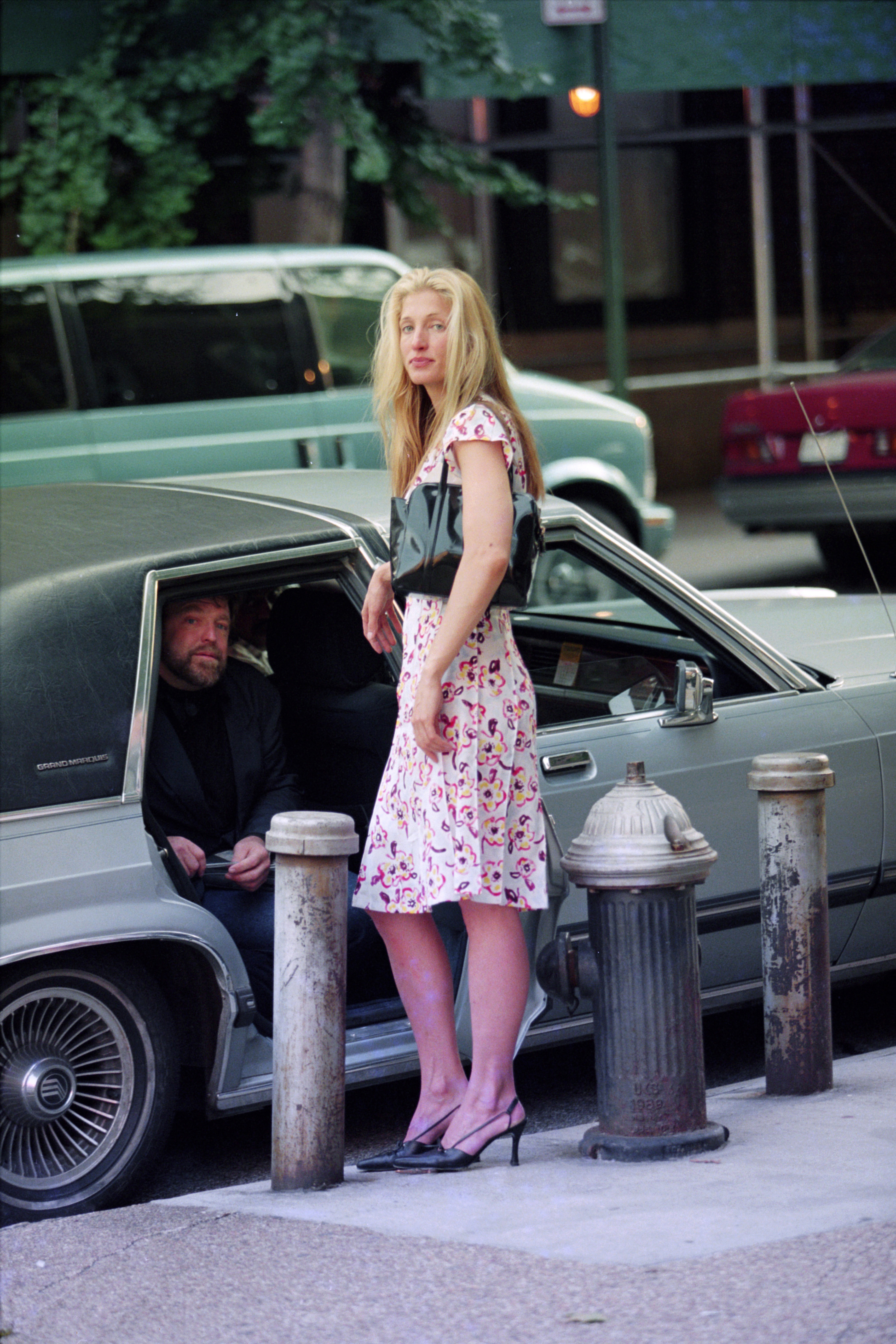 Carolyn Bessette Kennedy next to a car in lower Manhattan
