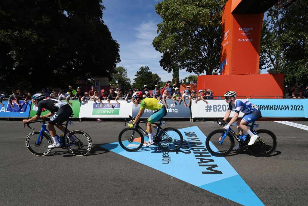WARWICK ENGLAND AUGUST 07 Jack Bauer of Team New Zealand Miles Scotson of Team Australia and Mark Stewart of Team Scotland compete during the Mens Road Race on day ten of the Birmingham 2022 Commonwealth Games at on August 07 2022 on the Warwick England Photo by Justin SetterfieldGetty Images