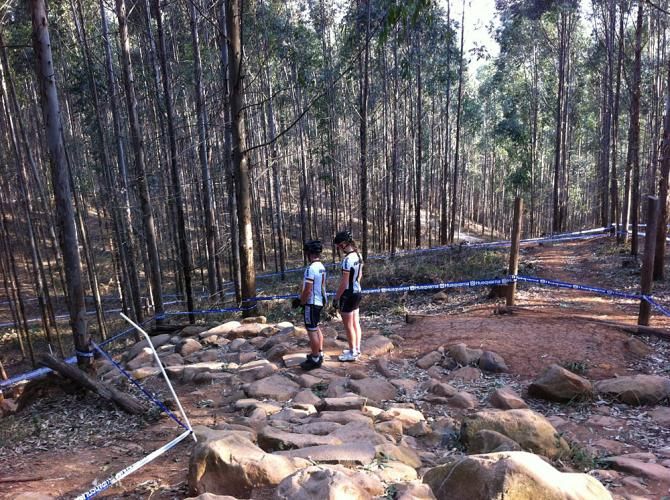 A German rider and her coach walk through the Treehouse Rock Garden section of the cross country course.