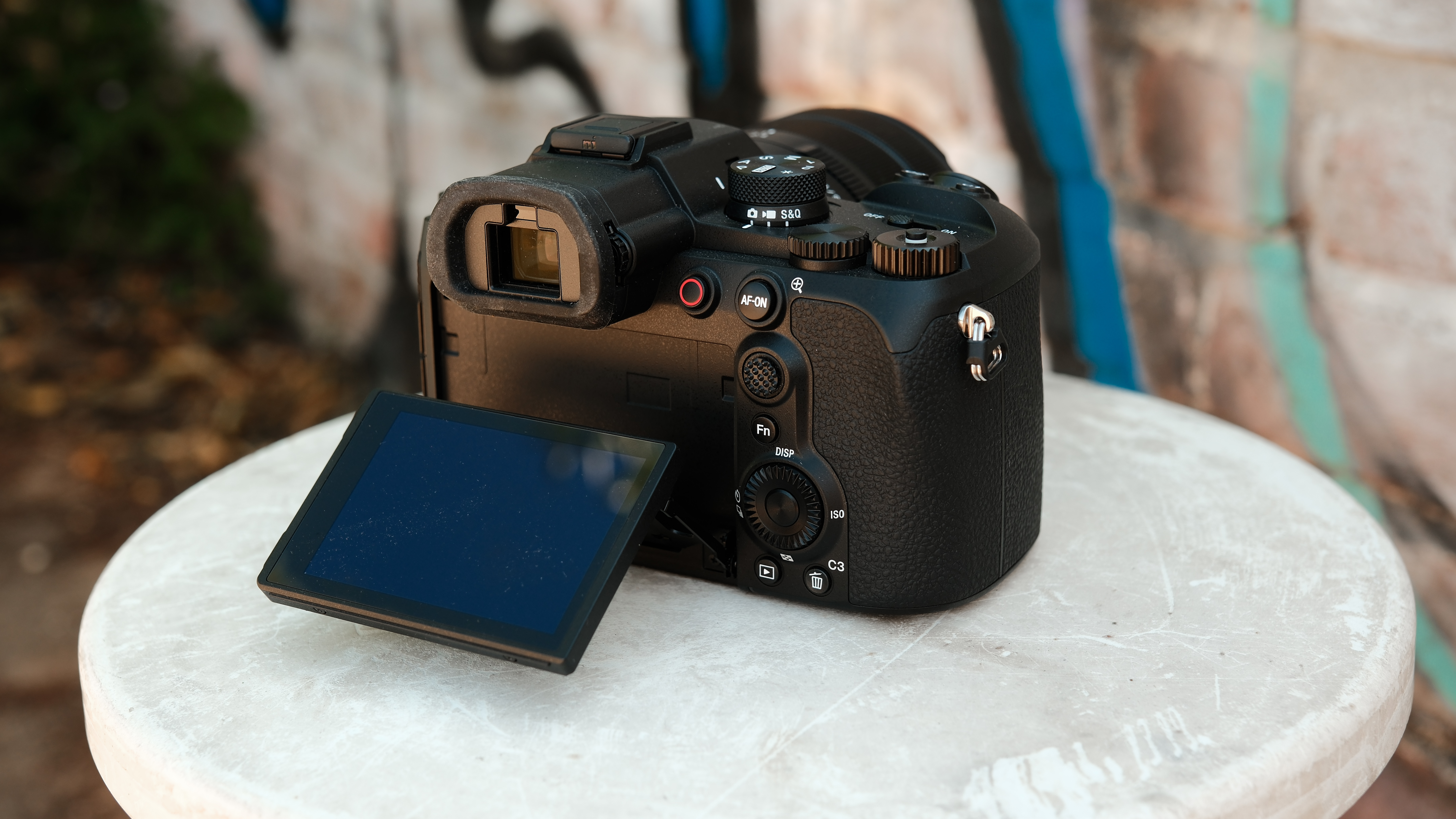 Rear view of the Sony RX10 V with its vari-angle touchscreen folded outward.