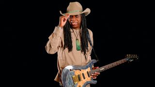 Session legend Larry Mitchell tips his Stetson as he's photographed with his Knaggs guitar