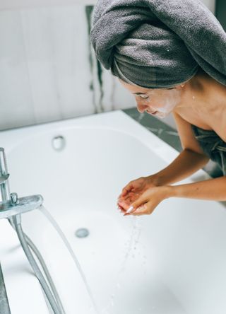 Woman washing face