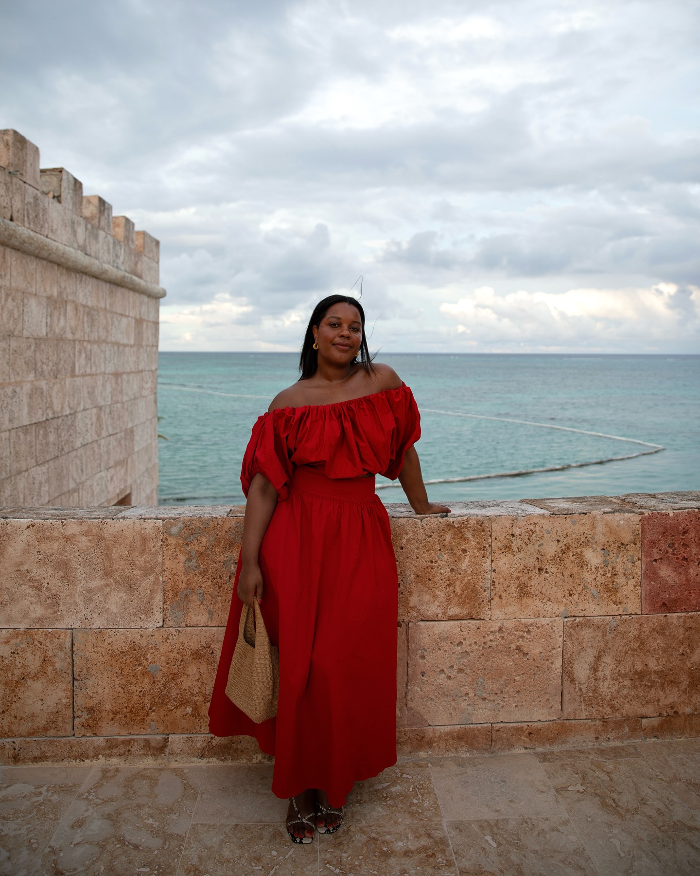 Rich looking summer outfits: @styleidealist wears a red dress with snake effect sandals