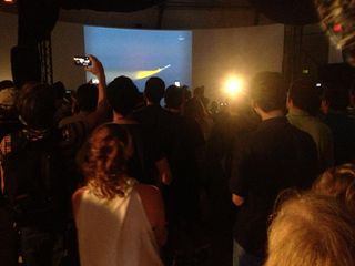 Members of the public at NASA's Ames Research Center in Moffett Field, Calif., watch a live video feed of the agency's IRIS solar telescope as it soars toward space from a drop point over the Pacific Ocean on June 27, 2013.