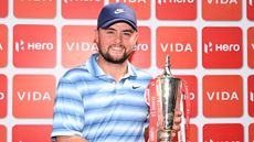 Alex Fitzpatrick poses for a photo with the Hero Indian Open trophy