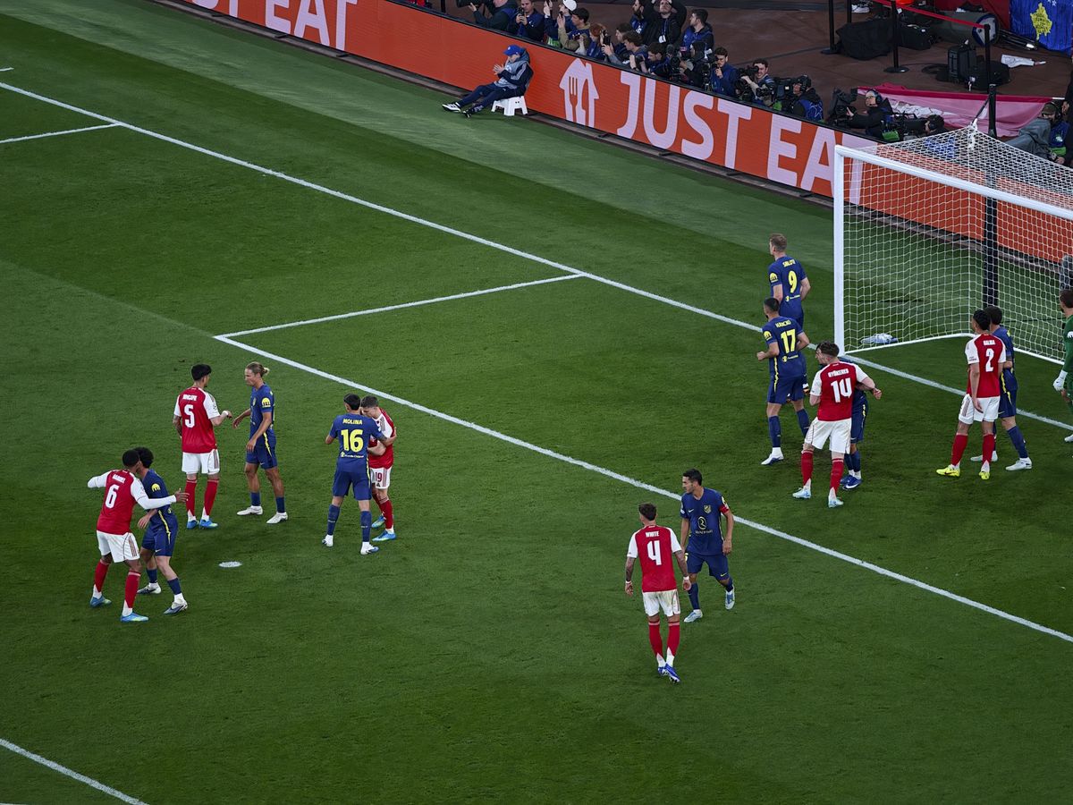 Action photos during a Champions League soccer match at Arsenal's Emirates stadium, taken with the Oppo Find X9 Ultra and teleconverter lens