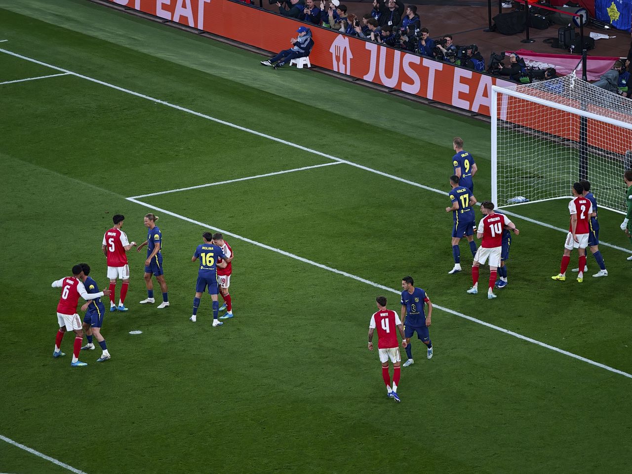 Action photos during a Champions League soccer match at Arsenal's Emirates stadium, taken with the Oppo Find X9 Ultra and teleconverter lens