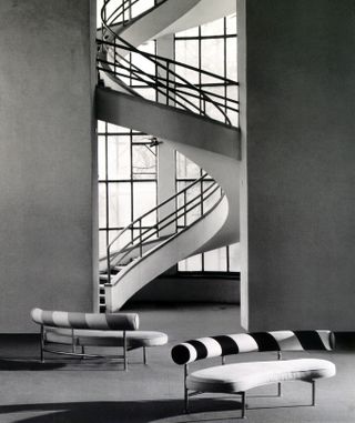 Flexform Max sofas at base of spiral staircase