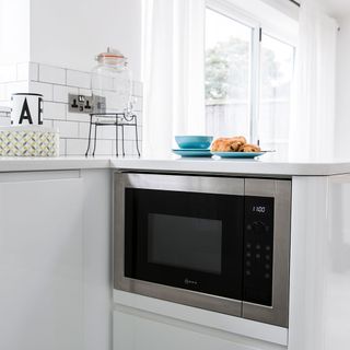 white cabinet with trendy microwave