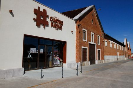 The Cuatro Rayas winery – a cream building with the cooperative's logo in dark red