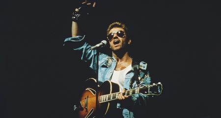 George Michael plays his Gretsch Synchromatic 160 onstage during his debut solo tour in 1988.