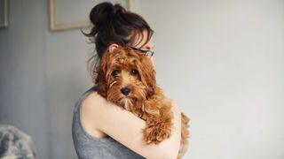 Woman holding a dog