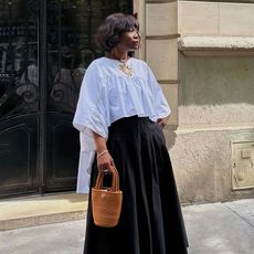 French influencer Frann Fine in Paris in black and white outfit.