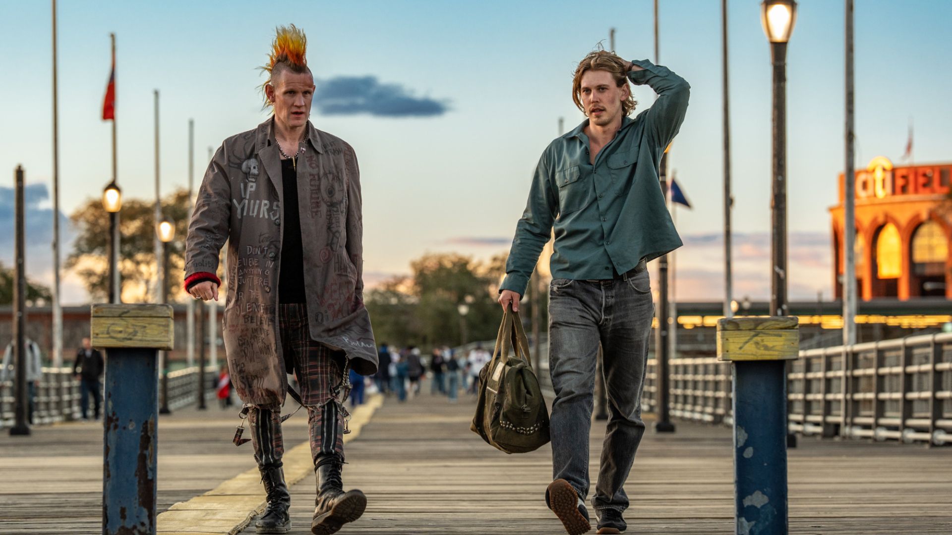 an image of matt smith and austin butler in the film caught stealing walking down a pier