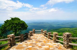 A rock pathway leads to a beautiful sweeping view of Mount Magazine State Park in Arkansas