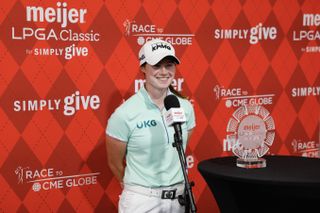 Leona Maguire poses next to the Meijer LPGA Classic trophy