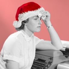 Woman in Christmas Hat Looking Forlorn