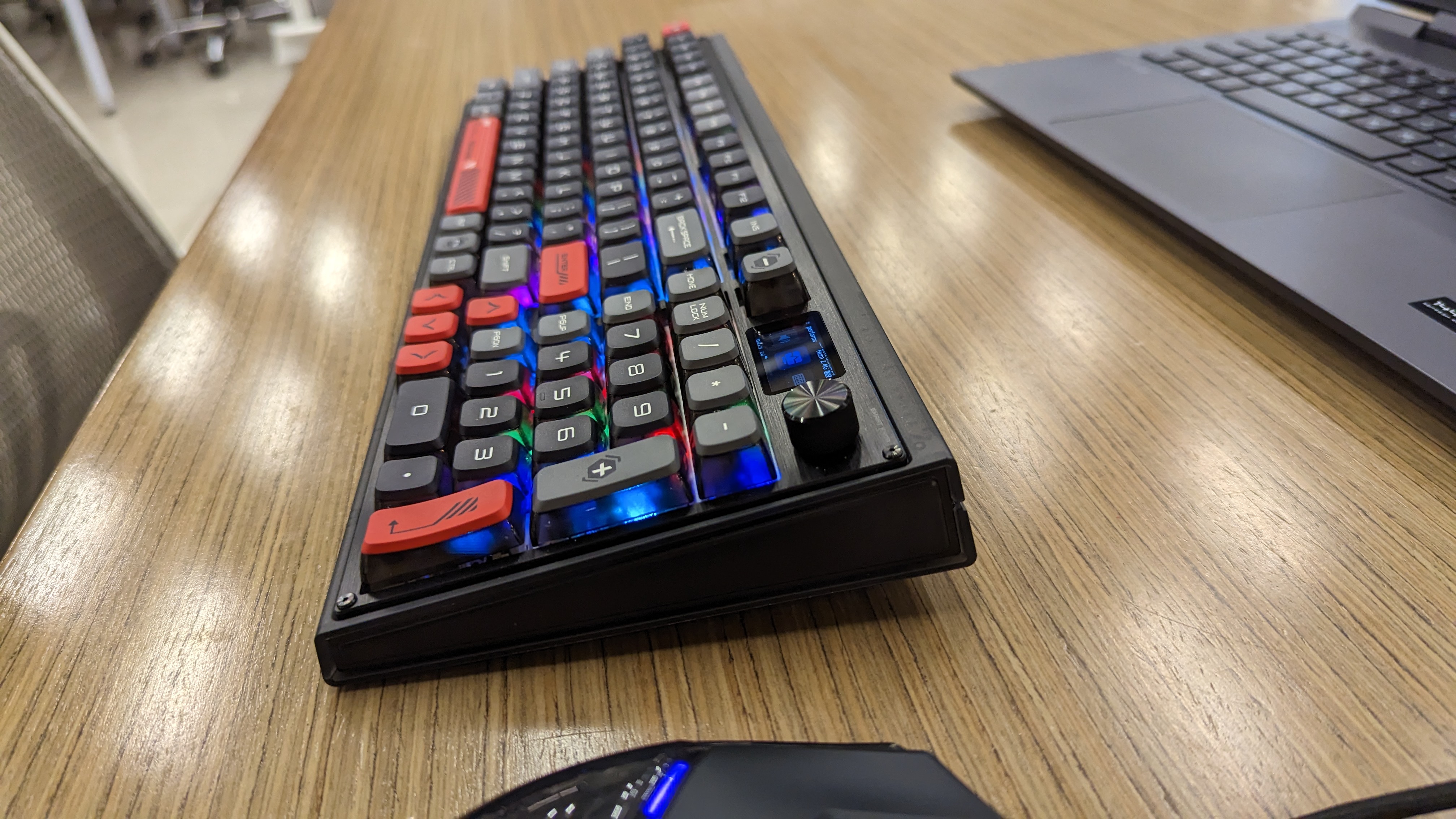 RedMagic Mechanical Keyboard on a wooden desk.
