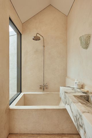 a small tadelakt style bathroom