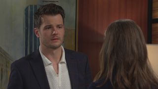 Michael Mealor as Kyle talking to a woman in The Young and the Restless