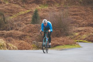 Male cyclist struggling on a bike ride after failing to fuel enough