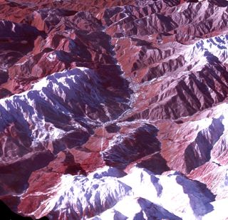 The 2014 Winter Olympic ski runs may be rated double black diamond, but they're not quite as steep as they appear in this image of the skiing and snowboarding sites for the Sochi Winter Olympic Games, acquired on Jan. 4, 2014, by NASA's Terra satellite. Rosa Khutar ski resort near Sochi, Russia, is in the valley at center, and the runs are visible on the shadowed slopes on the left-hand side of the valley.
