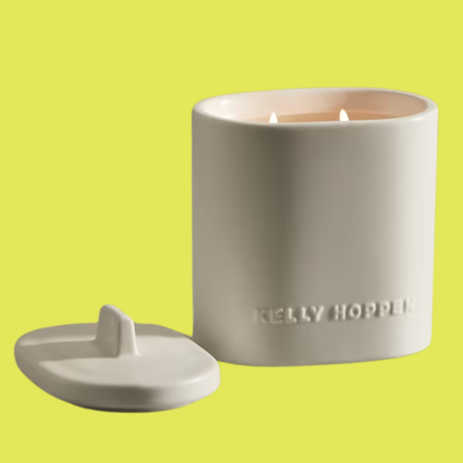 A white scented candle with a lid