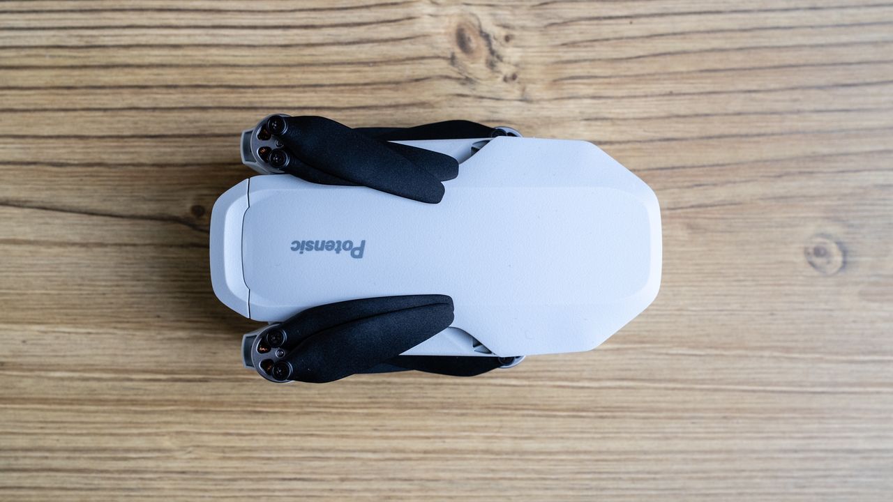 Potensic Atom SE drone on a wooden floor