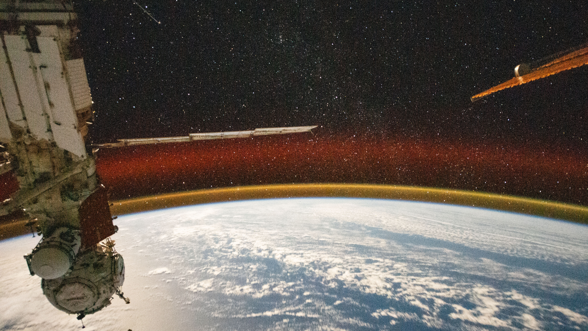 See Earth’s atmosphere glow gold in gorgeous photo taken from the ISS Space