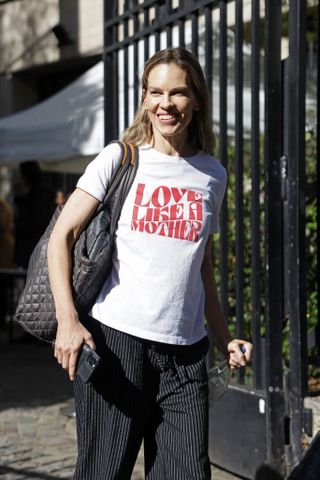 Hilary Swank in a T-shirt after walking for Miu Miu