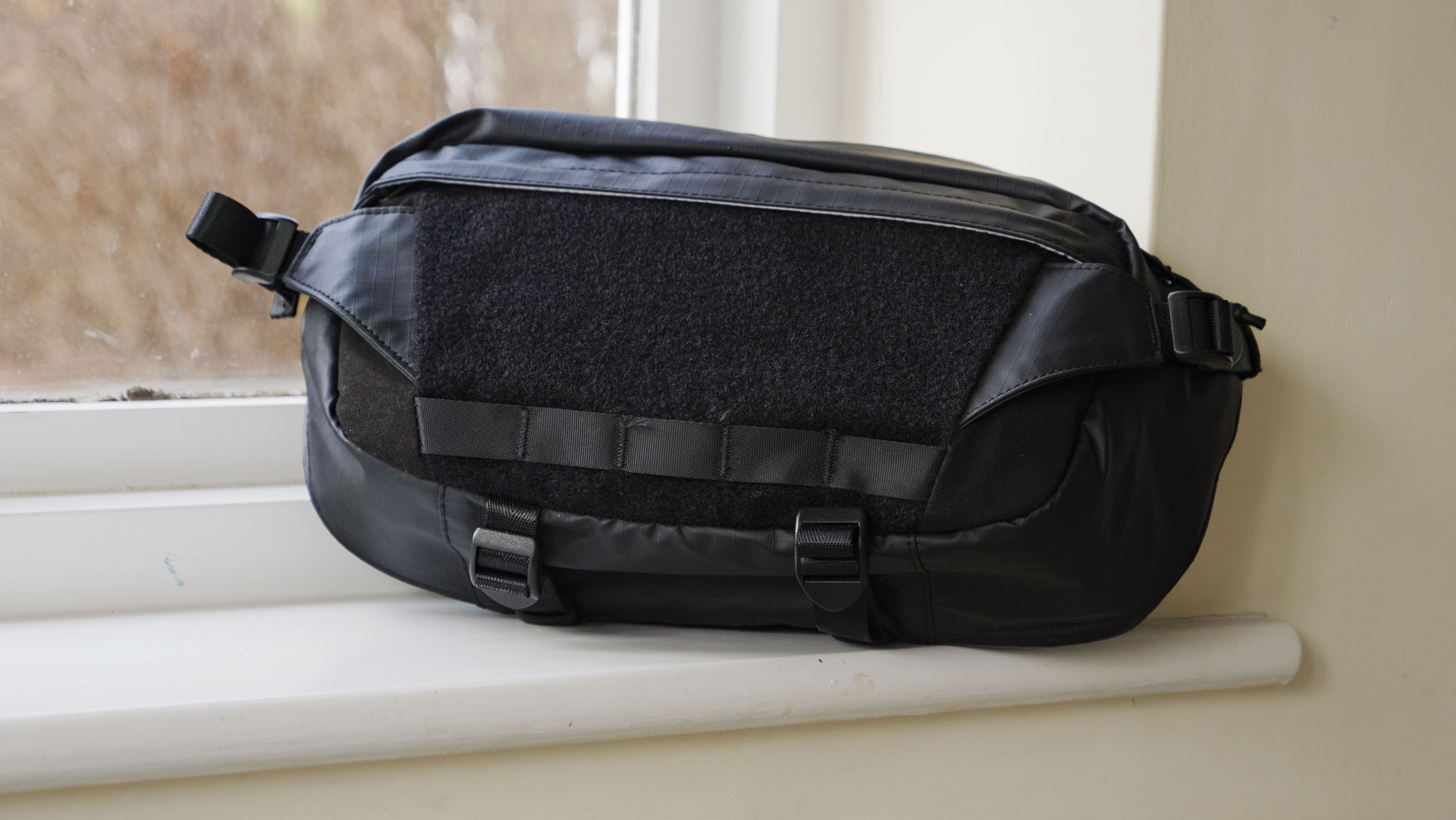 Ulanzi Camera Sling Bag on a window ledge